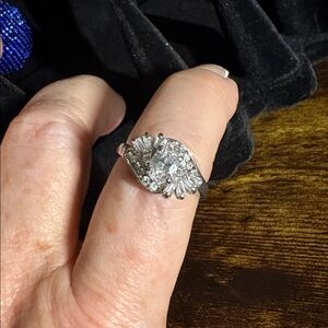 Silver with an Oval Solitaire with Baguettes and Round Rhinestones Ring size 9